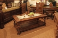 Traditional style oak pot-board coffee table with glass top.