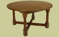Extendable round dining table, handmade in England from our Wilmington bespoke oak furniture range.