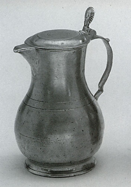 Traditional pewter jug with lid