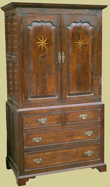 Oak linen press cockbeaded drawer