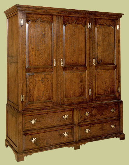 Handmade oak linen press 3-door, 4-drawer.