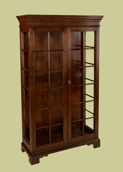 Oak bookcase with full height glazed doors, 5 adjustable height shelves, shaped plinth and deep moulded cornice.
