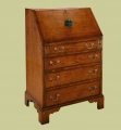 Change main image to Antique style oak bureau shown closed. Antique style oak bureau shown closed.