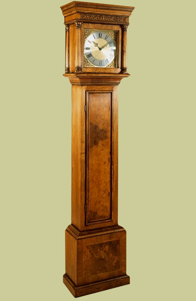Walnut veneered period style longcase clock.