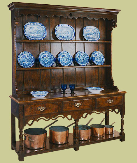 Potboard high dresser with attractive shaped and pierced apron over hand turned baluster support legs.