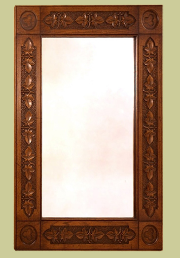 A period style mirror with a hand carved oak frame.