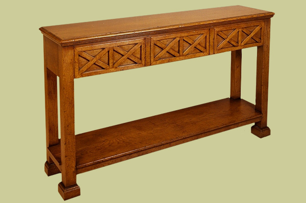 Oak pot board console table, with plain square legs and attractive applied mouldings to the three drawers.
