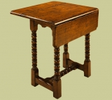 Oak folding top lamp table with bobbin turnings