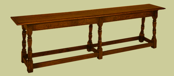 17th century style oak bench, with 6 baluster turned legs.