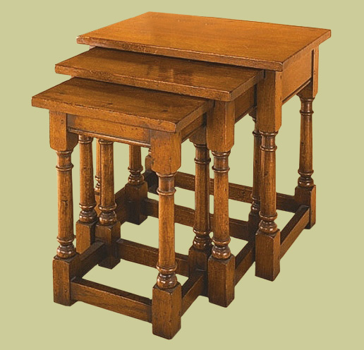 Oak nest of tables, front loading.