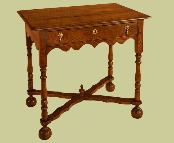 A period style oak side table with bun feet.