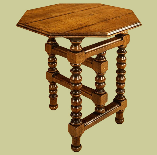Oak tilt top occasional table with repeat turned legs.