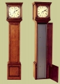 Oak gun cabinet which doubles as a long case clock.