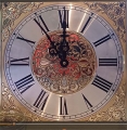 Long case clock gun cabinet clock face