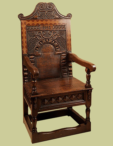 Charles 2nd Style oak armchair, with hand carved back panel, cresting rail and seat rails.