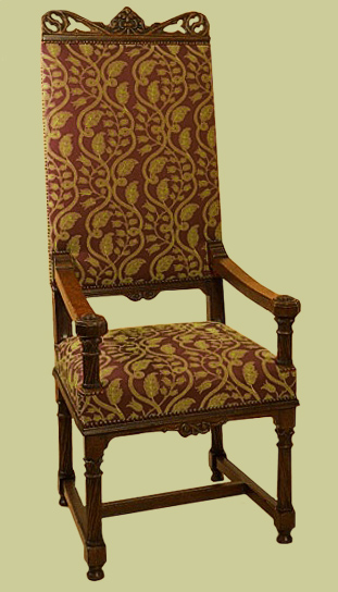 Carved throne type upholstered armchair.