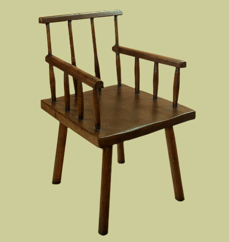 Cottage style comb back armchair.