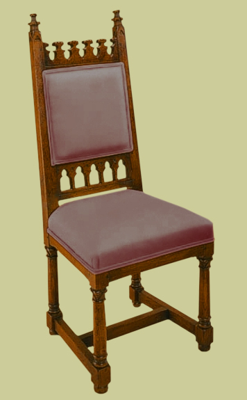 Upholstered Gothic style hand-carved oak side chair.