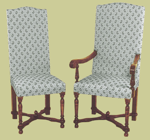 Period style upholstered oak dining chairs, with flat cross-stretchers and small decorative finial.