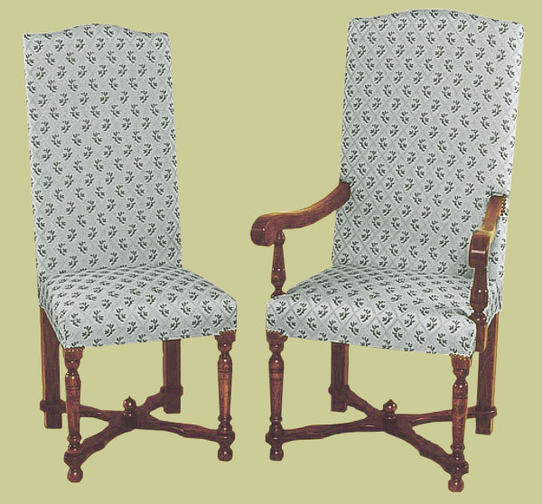Period style upholstered oak dining chairs, with flat cross-stretchers and small decorative finial.