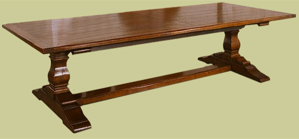 Pedestal table, with massive square cut baluster legs on heavy section cross feet.