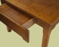 Detail of oak extending dining table, in French style, with 2 centred leaves and 2 drawers.
