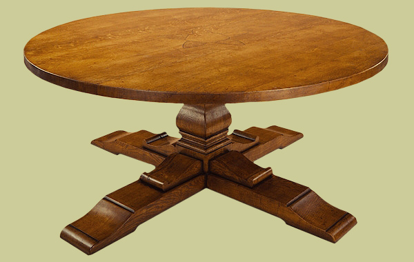 Oak round table on cruciform base with massive square cut centre pedestal.