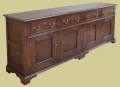 Four drawer period style oak dresser base.