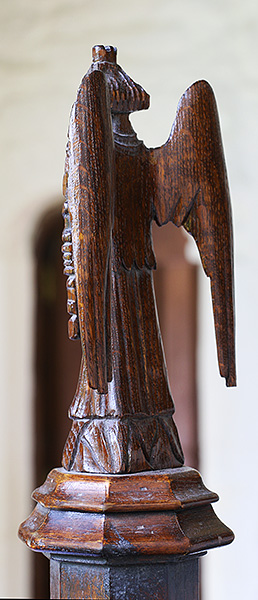 15th century style carved oak angel back view