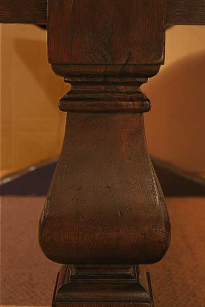 Hand cut square baluster on oak dining table