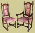 Oak chairs, in period style, with upholstered back panels and stuff-over seats.