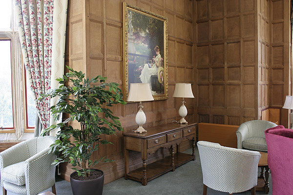 Oak potboard dresser in oak panelled room of old priory