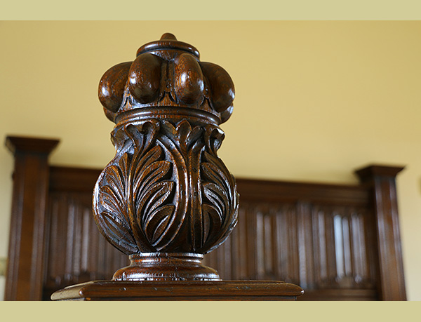 Hand carved finial on oak bed