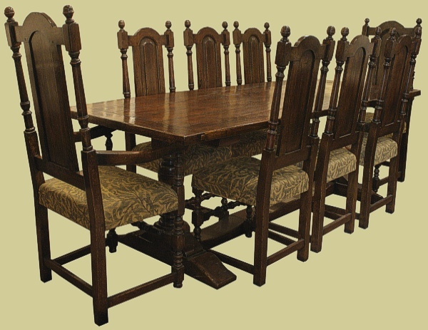 Pedestal oak refectory table with 8 upholstered oak dining chairs