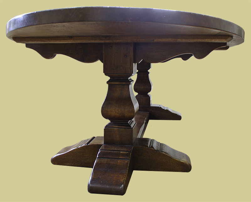 Detail of 16th century style square cut baluster pedestal supports on large oak oval table
