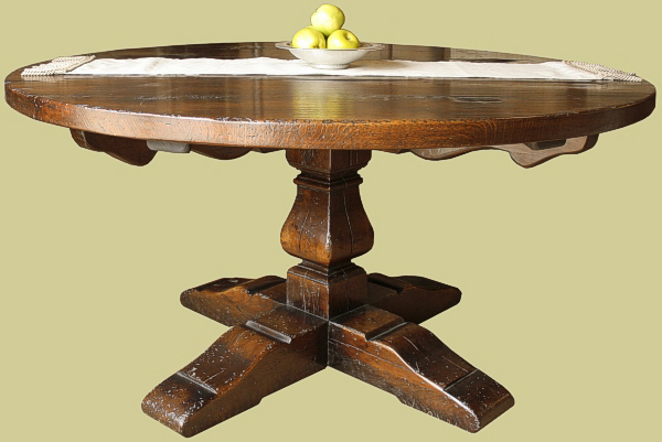 Period style round oak dining table