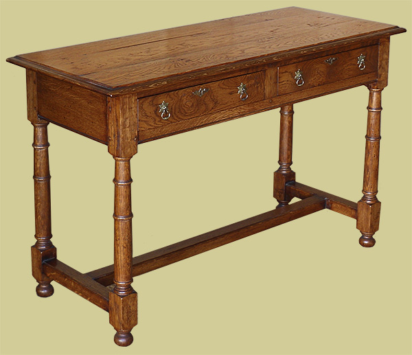 Oak side table, in traditional style, with two drawers and gunbarrel turned legs.