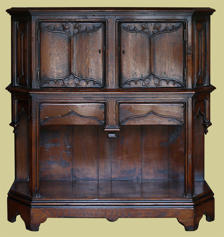 Period style canted carved oak livery cupboard
