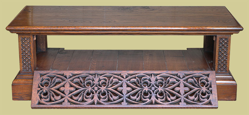 Oak TV stand with pierced Elizabethan style strapwork carved DVD compartment flap open