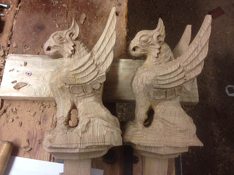 Oak griffins part carved for chapel bed