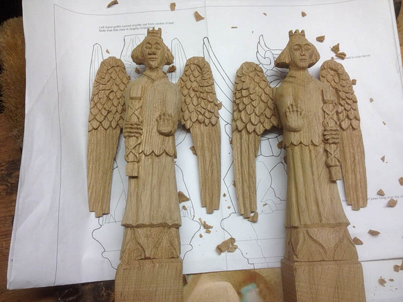 Oak angels part carved for chapel bed