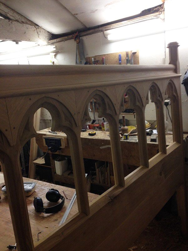 Oak open tracery headboard of chapel bed, in the making