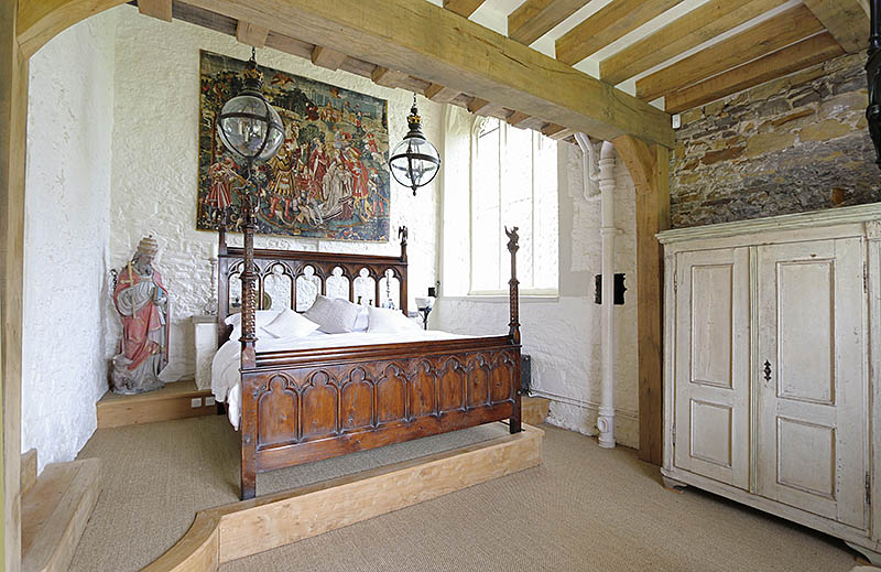 The finished bespoke designed carved oak Medieval style chapel bed