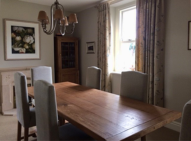 Oak pedestal dining table, with fully upholstered side chairs and glazed display cupboard