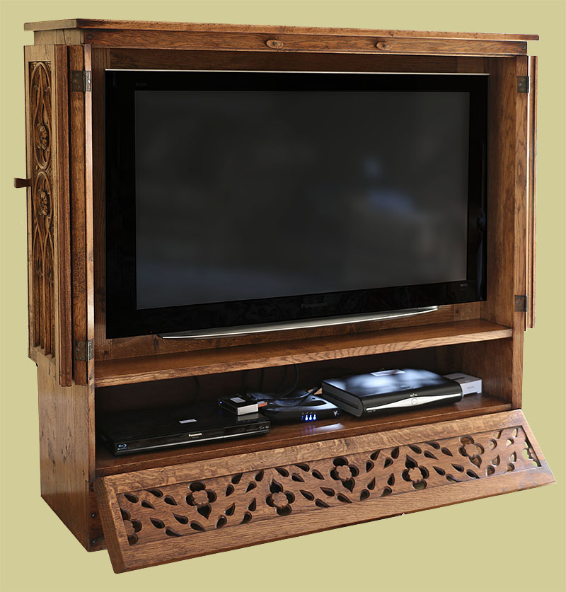 Hand carved oak TV cabinet, shown in fully open access mode, to load dvd