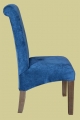 Side view of modern upholstered chair to compliment heavy traditional oak furniture.