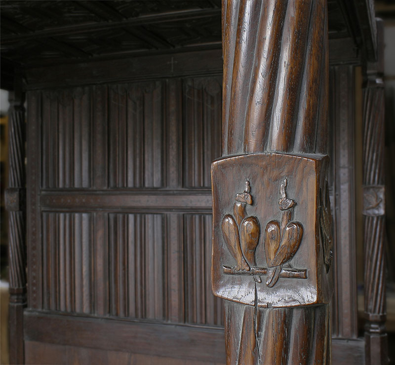 Hand carved falcon detail, on foot board post of early 16th century Tudor style oak four poster bed