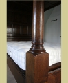 Foot post detail on specially designed and handmade oak 4-poster tester bed.