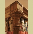 Carving detail on foot posts of unique Gothic style four poster bed.