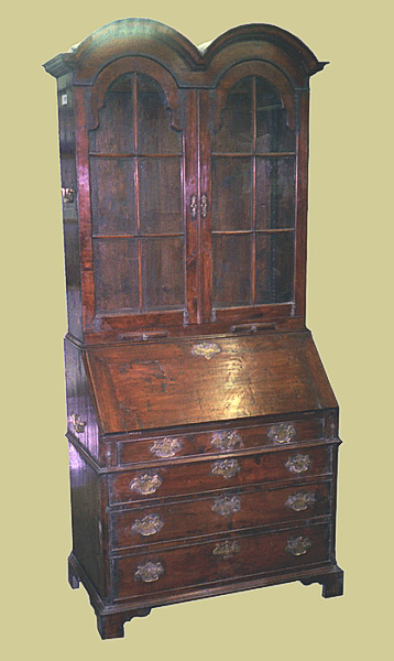 Oak 4-drawer bureau, with glazed bookcase type upper section, having domed top doors and double dome hood